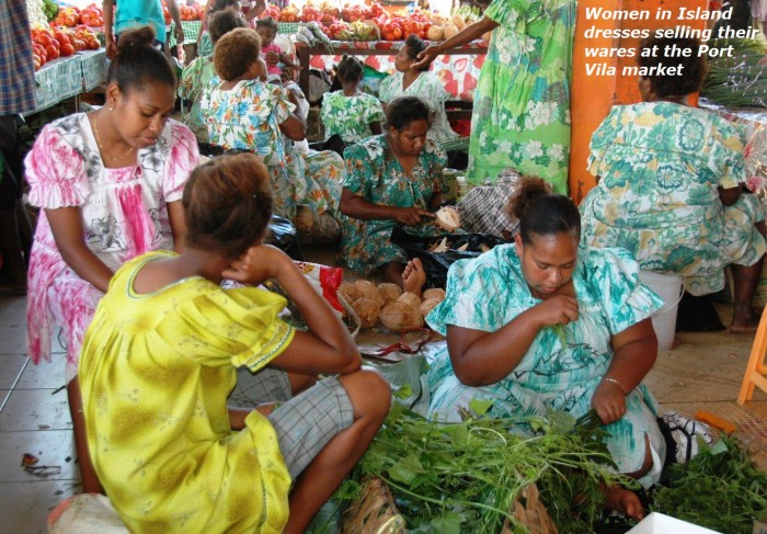 Women in island dresses selling their wares at the Port Vila market